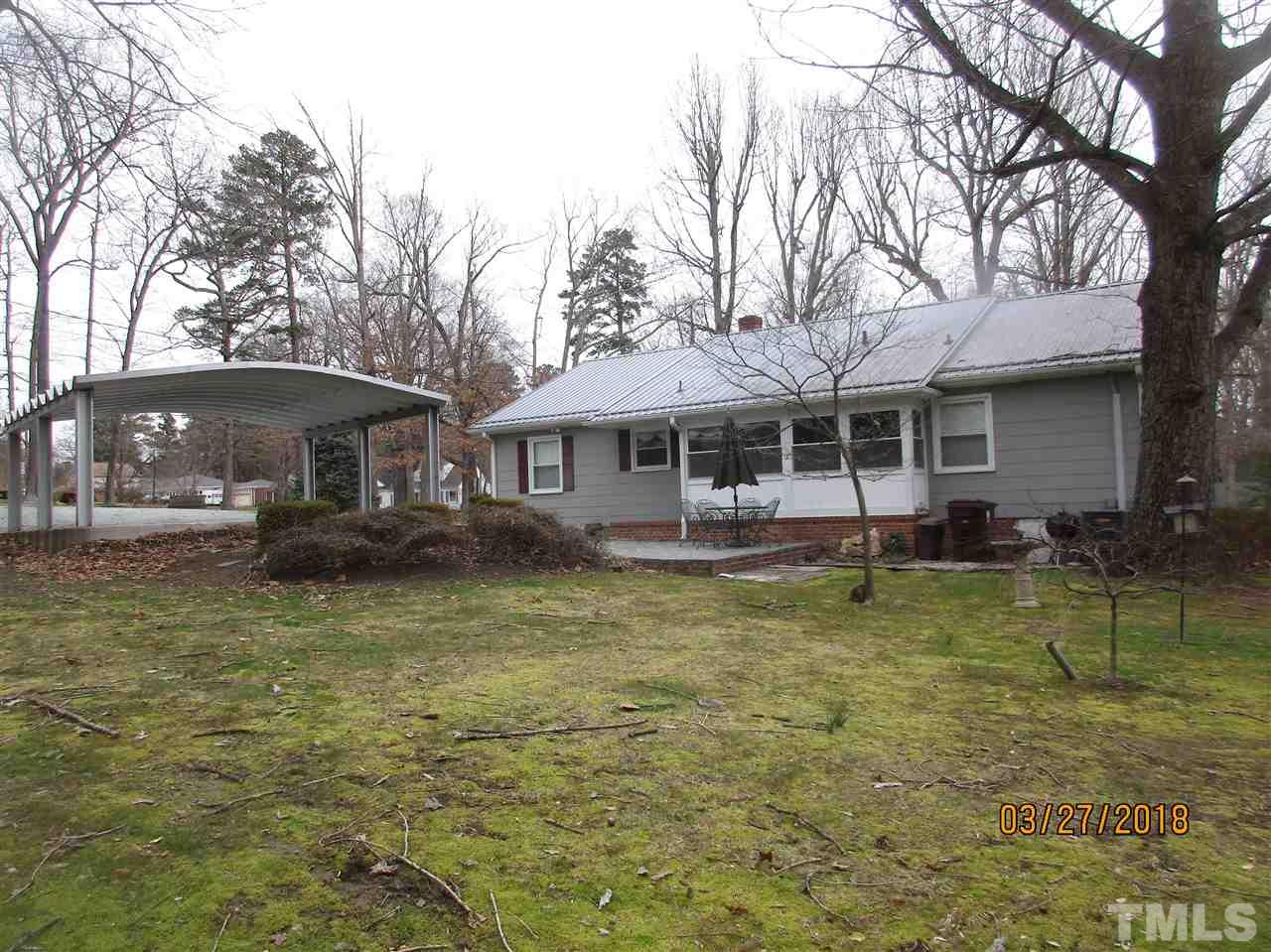 511 Gordon Street Roxboro, NC 27573 - Photo 5 of 25 a front view of a house with a yard table and chairs