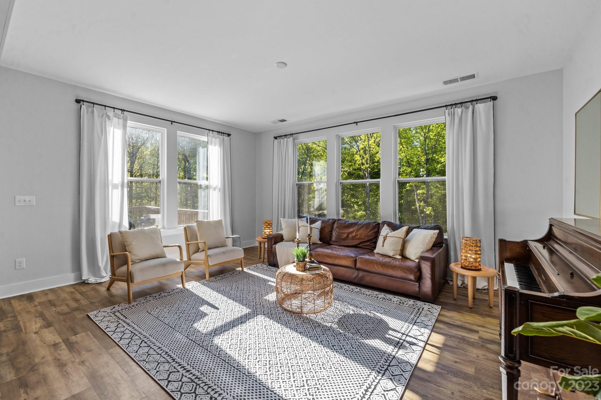 6284 Six String Court Fort Mill, SC 29708 - Photo 13 of 39 a living room with furniture and a large window