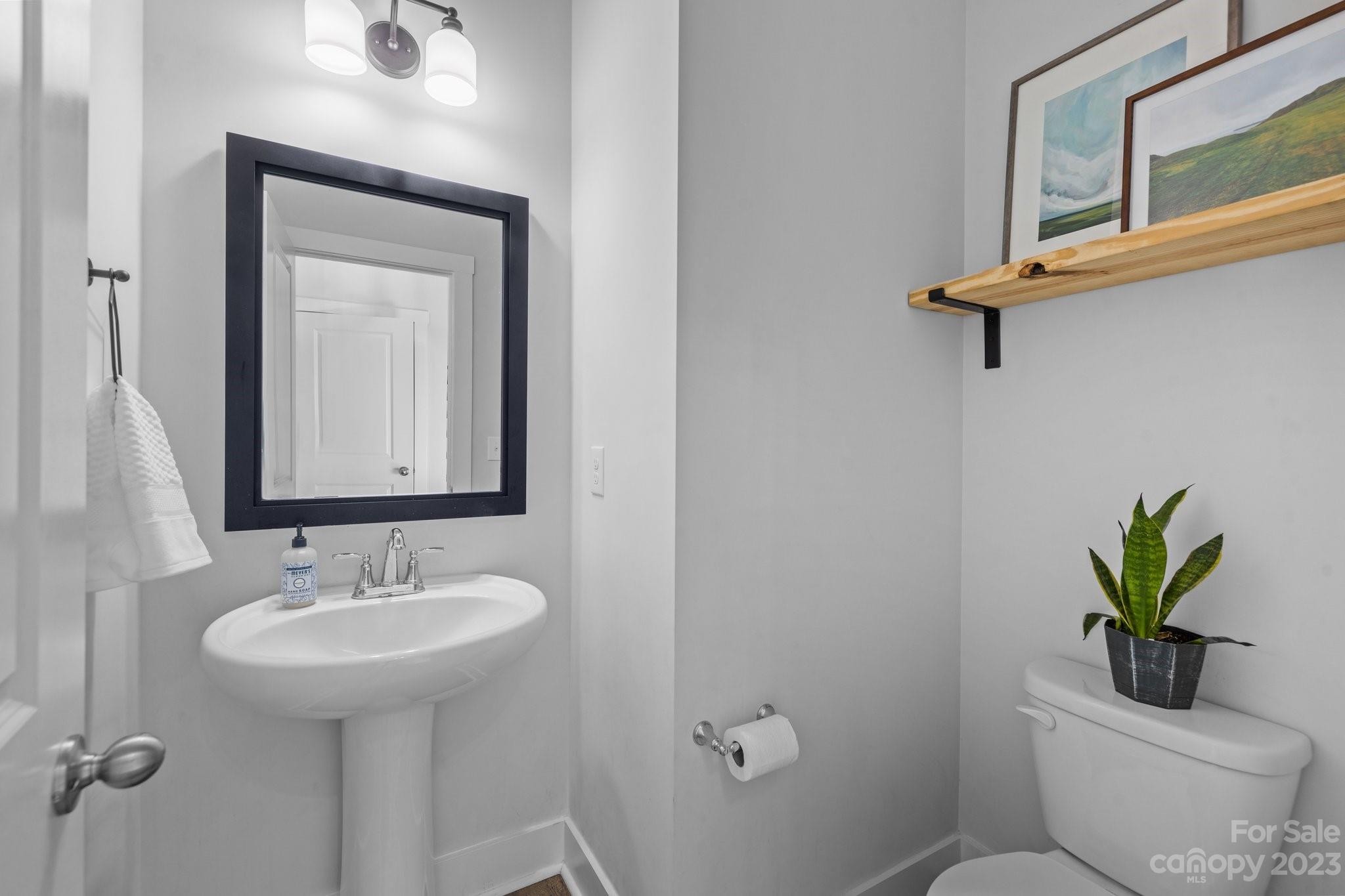 6284 Six String Court Fort Mill, SC 29708 - Photo 16 of 39 a bathroom with a toilet sink and mirror