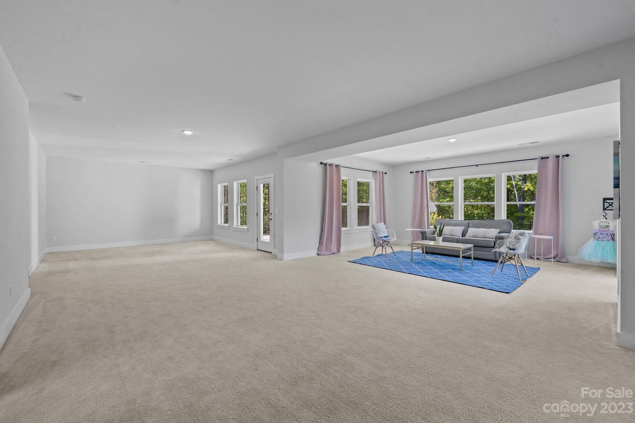 6284 Six String Court Fort Mill, SC 29708 - Photo 29 of 39 a view of a livingroom with couch and a large window