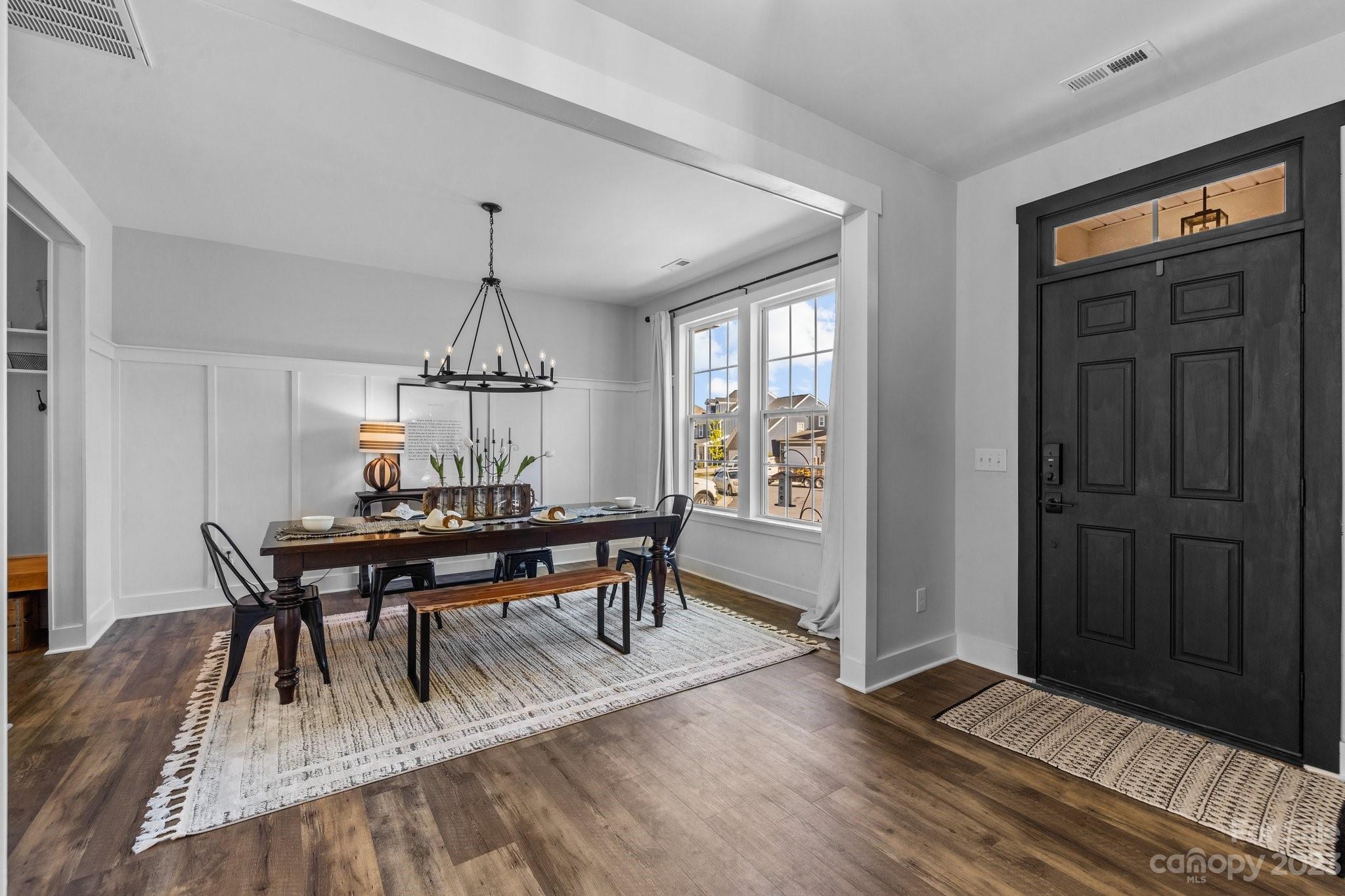 6284 Six String Court Fort Mill, SC 29708 - Photo 3 of 39 a view of a dining room with furniture window and wooden floor