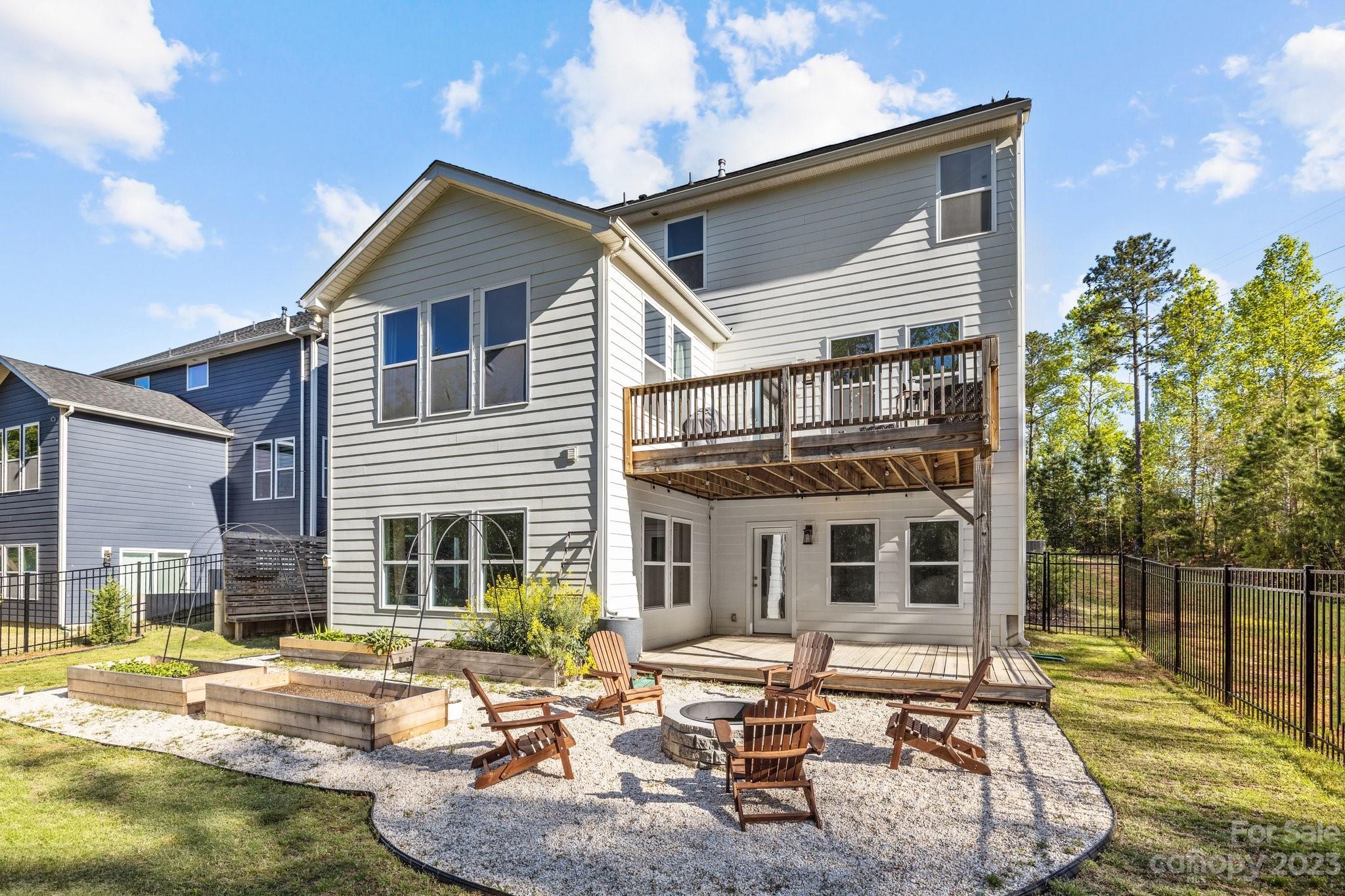 6284 Six String Court Fort Mill, SC 29708 - Photo 32 of 39 a view of a house with backyard and sitting area