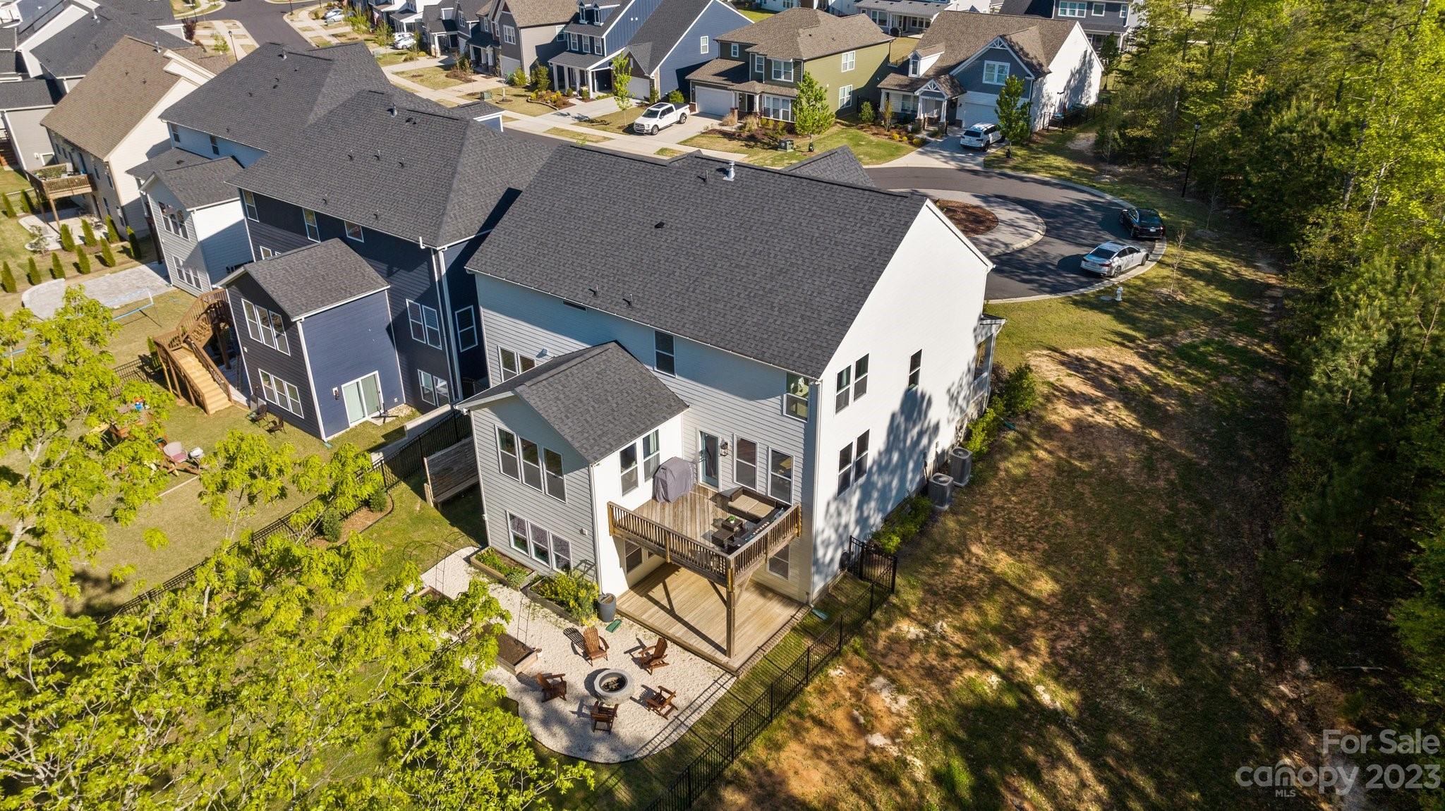 6284 Six String Court Fort Mill, SC 29708 - Photo 35 of 39 an aerial view of a residential apartment building with swimming pool and lawn chairs