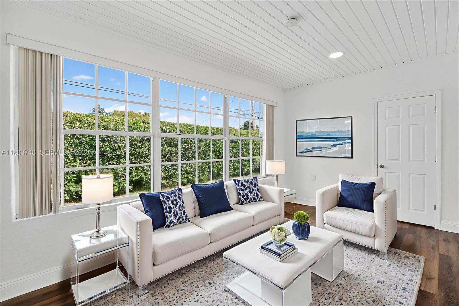 8371 Southwest 32nd Terrace Miami, FL 33155 - Photo 14 of 48 a living room with furniture and a large window