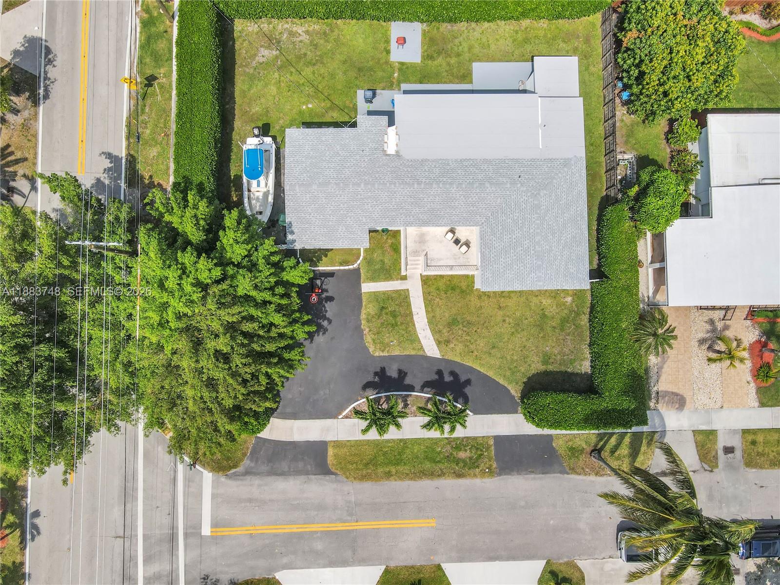 8371 Southwest 32nd Terrace Miami, FL 33155 - Photo 46 of 48 an aerial view of a house with a yard and large tree