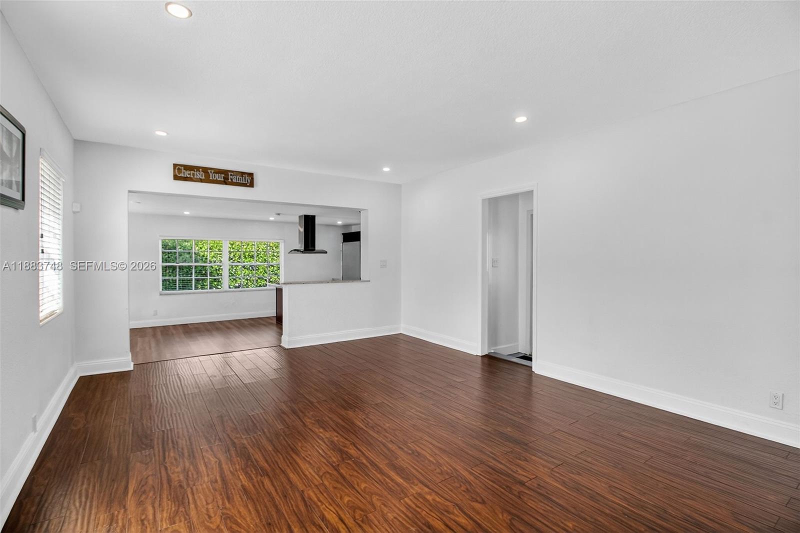 8371 Southwest 32nd Terrace Miami, FL 33155 - Photo 6 of 48 a view of empty room with wooden floor and fan