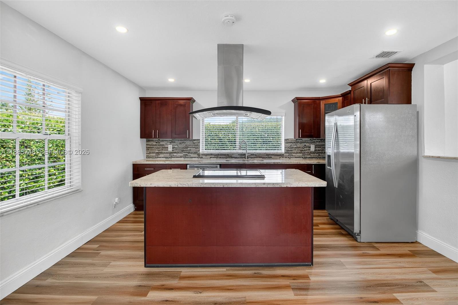 8371 Southwest 32nd Terrace Miami, FL 33155 - Photo 7 of 48 a kitchen with kitchen island a counter top space a sink stainless steel appliances and cabinets