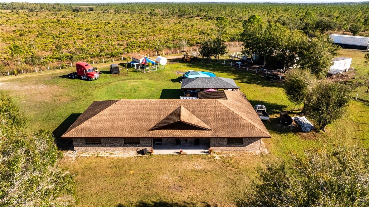 1472 Charolais Road Northwest LaBelle, FL 33935 - Photo 2 of 50 an aerial view of a house with a yard