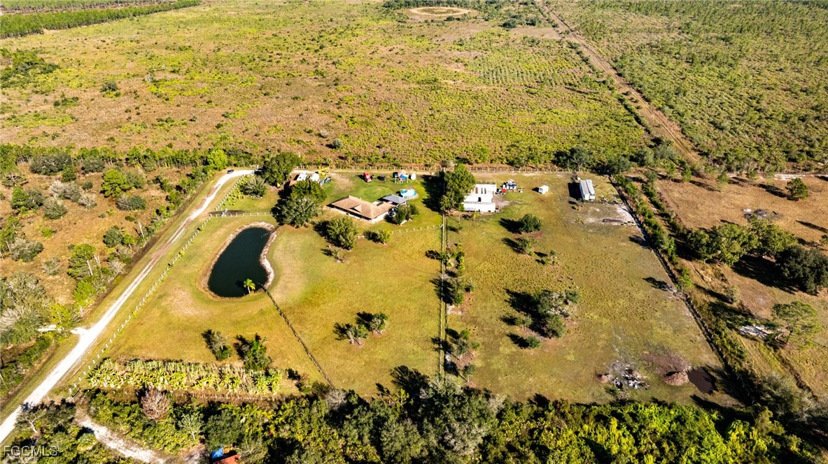 1472 Charolais Road Northwest LaBelle, FL 33935 - Photo 40 of 50 walk in view of lake