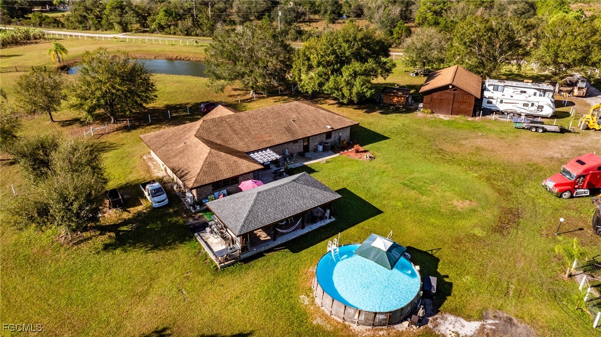 1472 Charolais Road Northwest LaBelle, FL 33935 - Photo 4 of 50 an aerial view of a house with yard swimming pool and outdoor seating