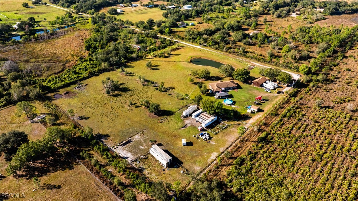 1472 Charolais Road Northwest LaBelle, FL 33935 - Photo 45 of 50 an aerial view of residential houses with outdoor space