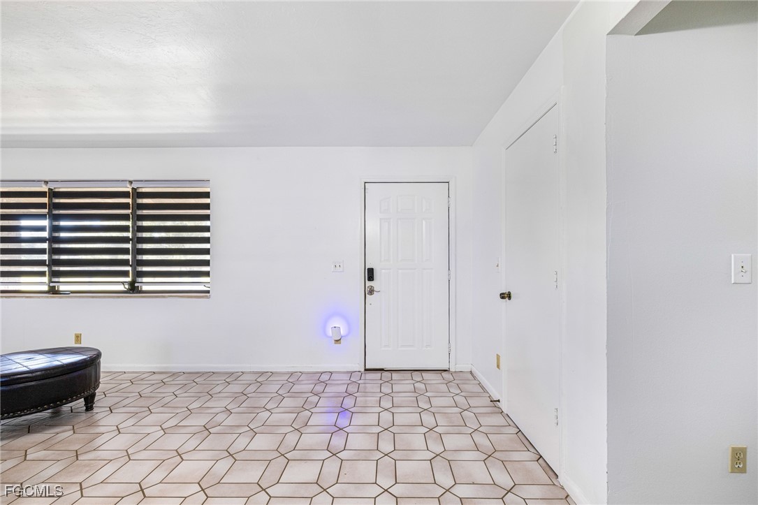 1472 Charolais Road Northwest LaBelle, FL 33935 - Photo 10 of 50 a bathroom with a sink and a mirror