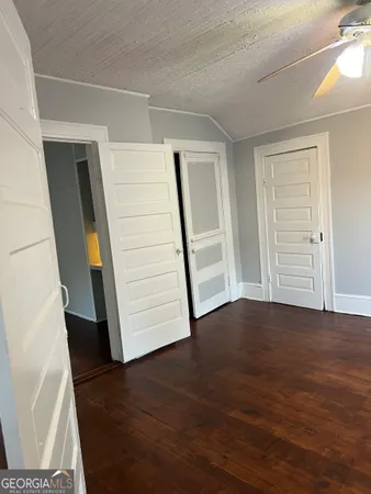a view of an entryway with wooden floor