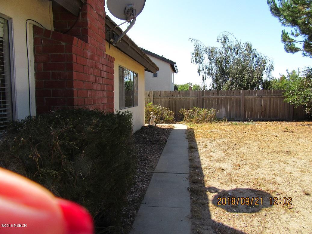 4376 Rigel Avenue Lompoc, CA 93436 - Photo 17 of 20 a swimming pool with outdoor seating and yard