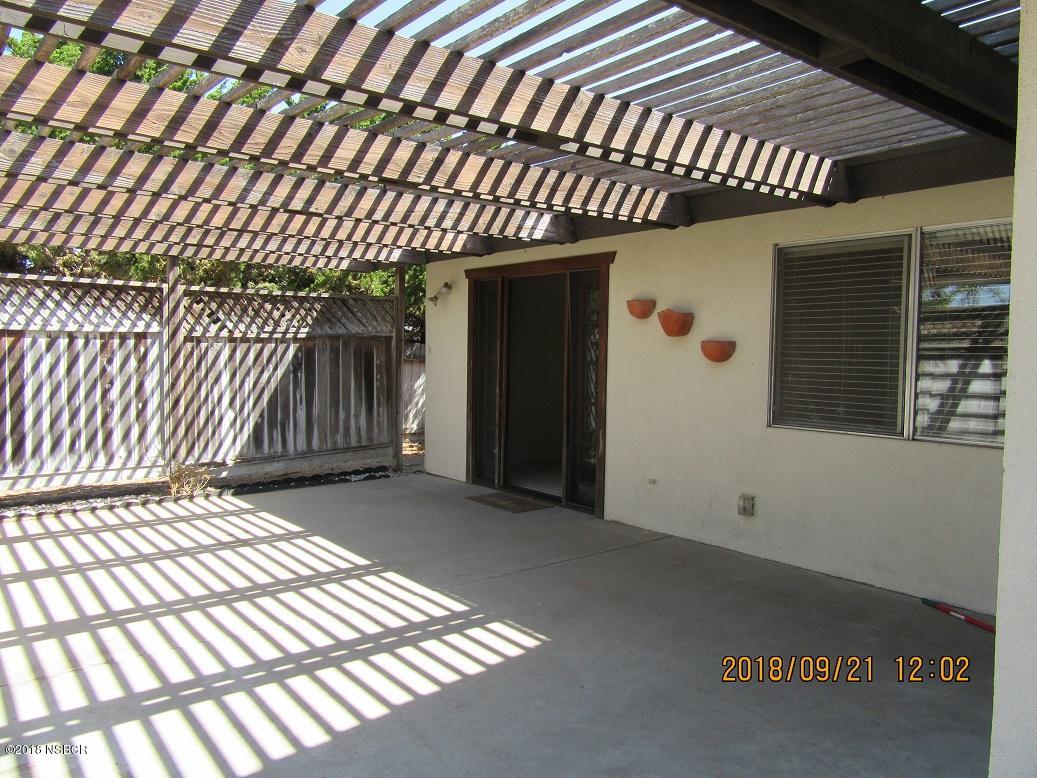 4376 Rigel Avenue Lompoc, CA 93436 - Photo 18 of 20 a view of backyard with barbeque grill wooden floor and brick wall