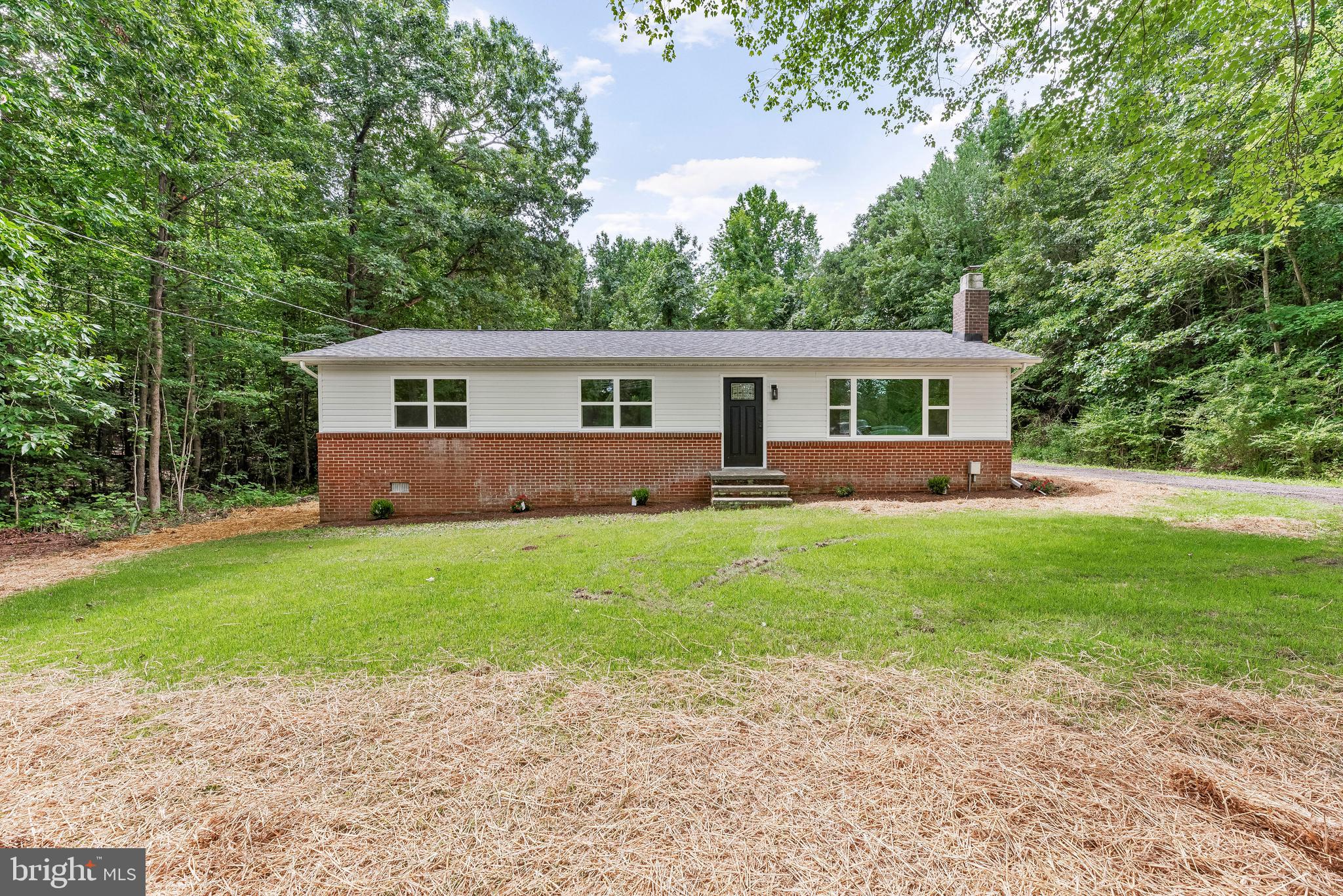 Large front yard offers quiet and privacy.
