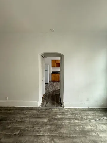 a view of a livingroom with wooden floor