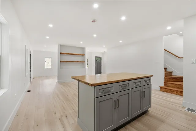 a kitchen with stainless steel appliances granite countertop a sink and cabinets