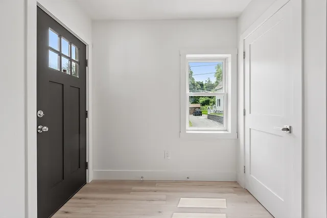 a view of an empty room with windows
