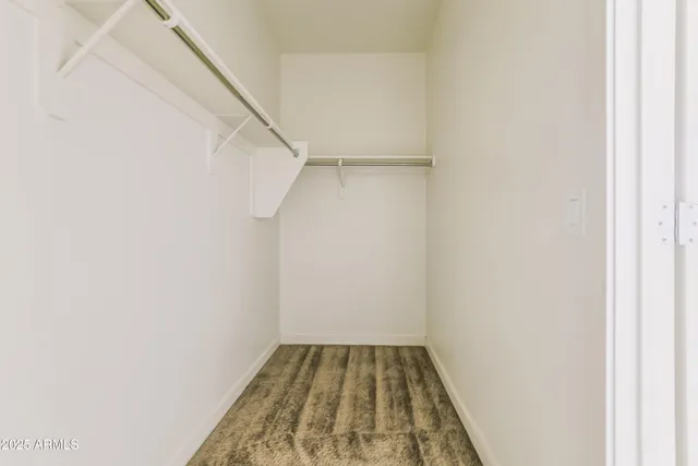 a view of a room with white walls