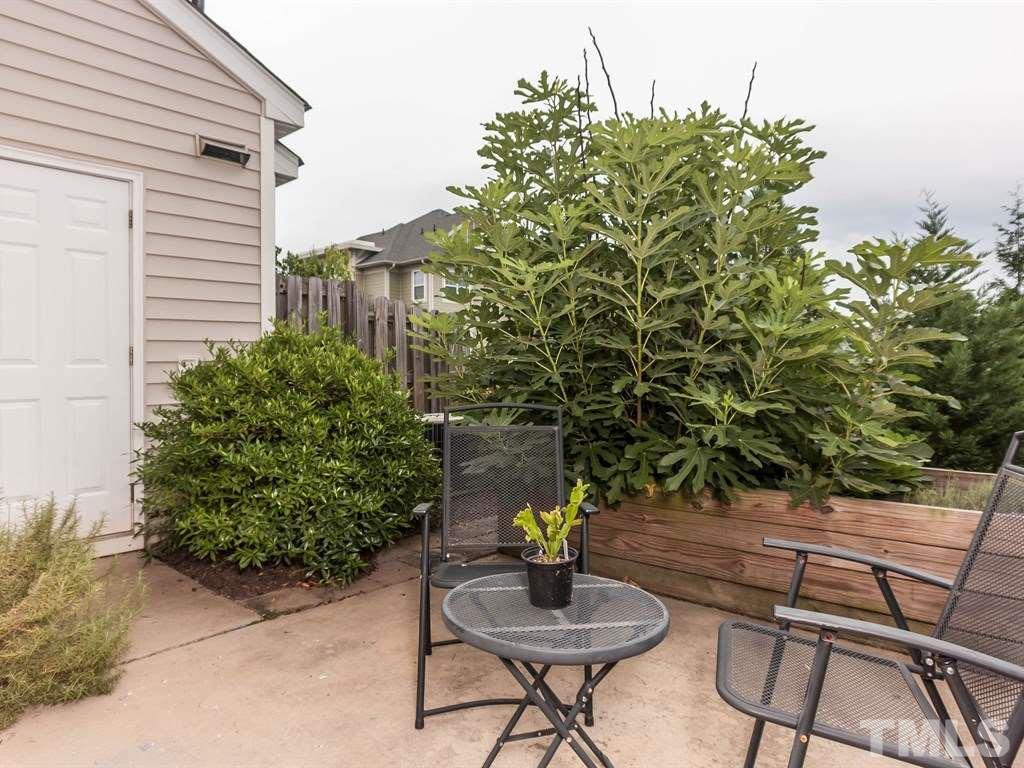 8149 Rhiannon Road Raleigh, NC 27613 - Photo 20 of 25 a view of a chairs and table in a patio