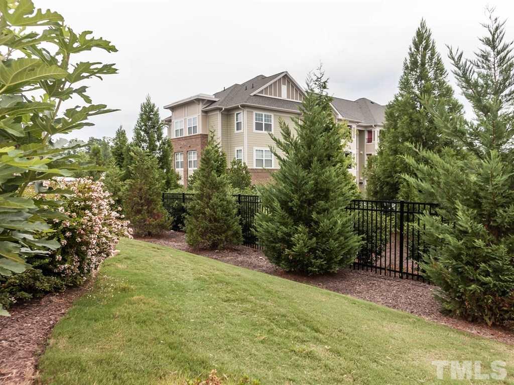 8149 Rhiannon Road Raleigh, NC 27613 - Photo 21 of 25 a view of a large garden with plants and large trees