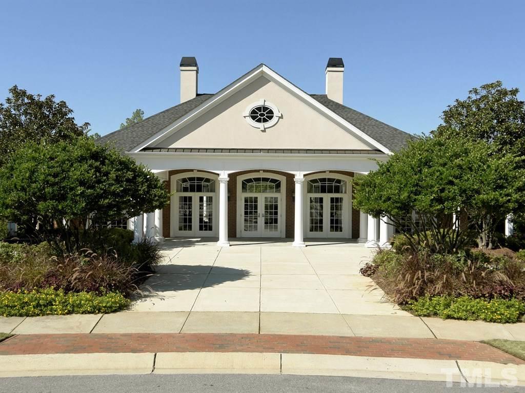 8149 Rhiannon Road Raleigh, NC 27613 - Photo 23 of 25 a front view of a house with garage and plants