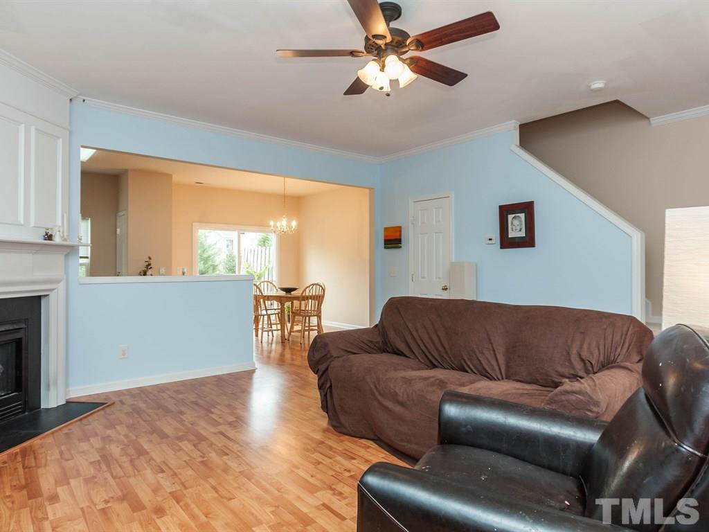 8149 Rhiannon Road Raleigh, NC 27613 - Photo 5 of 25 a living room with furniture and a large window