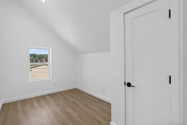 a view of a kitchen with wooden floor