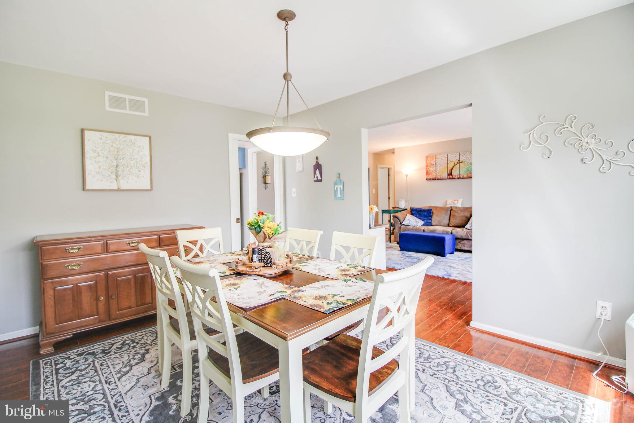 2408 Old Frederick Road Catonsville, MD 21228 - Photo 11 of 53 a view of a dining room with furniture and wooden floor