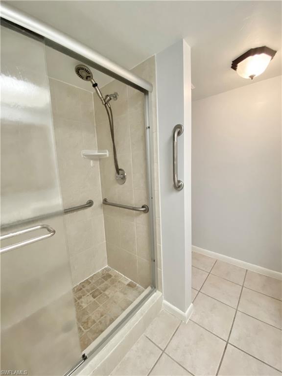 4955 Pepper Circle, Unit B204 Naples, FL 34113 - Photo 11 of 25 a bathroom with a shower