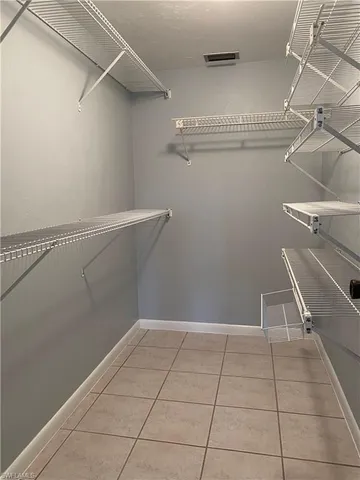 a bathroom with a sink a toilet a mirror and shower