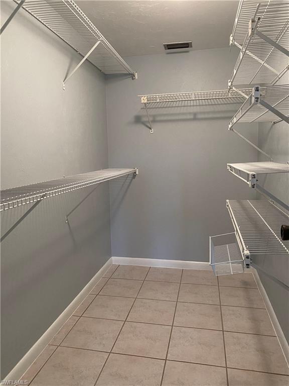 4955 Pepper Circle, Unit B204 Naples, FL 34113 - Photo 12 of 25 a view of a room with racks on the wall