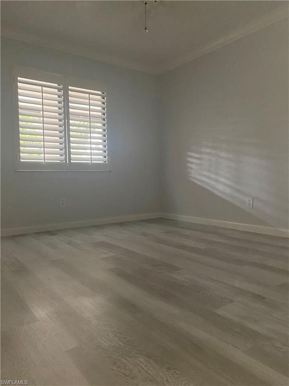 4955 Pepper Circle, Unit B204 Naples, FL 34113 - Photo 14 of 25 an empty room with a window