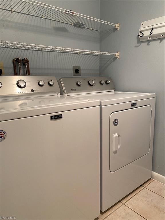 4955 Pepper Circle, Unit B204 Naples, FL 34113 - Photo 15 of 25 a utility room with dryer and washer