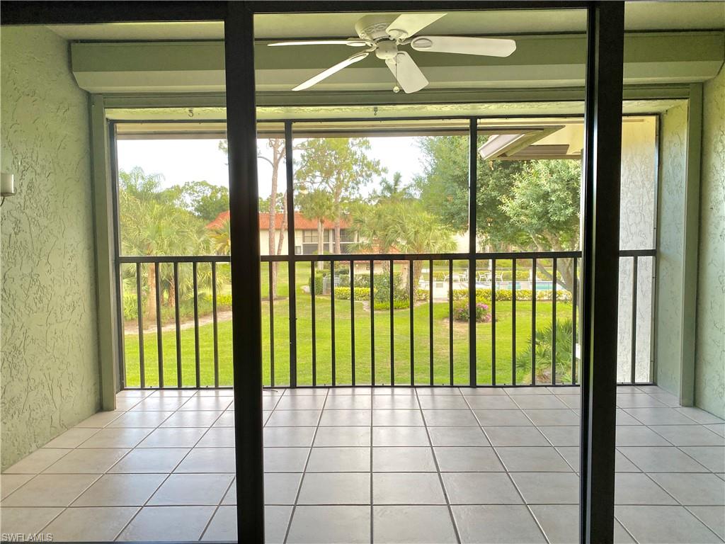 4955 Pepper Circle, Unit B204 Naples, FL 34113 - Photo 6 of 25 a view of an empty room with a window