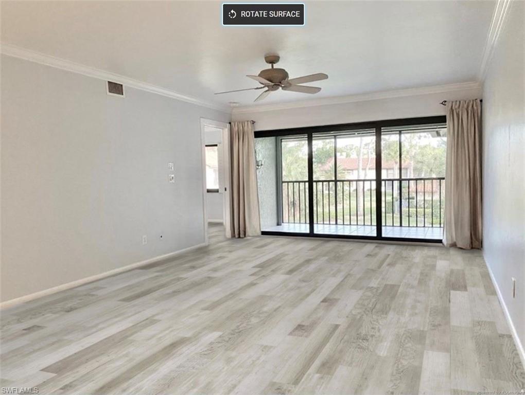 4955 Pepper Circle, Unit B204 Naples, FL 34113 - Photo 8 of 25 a view of an empty room with a window