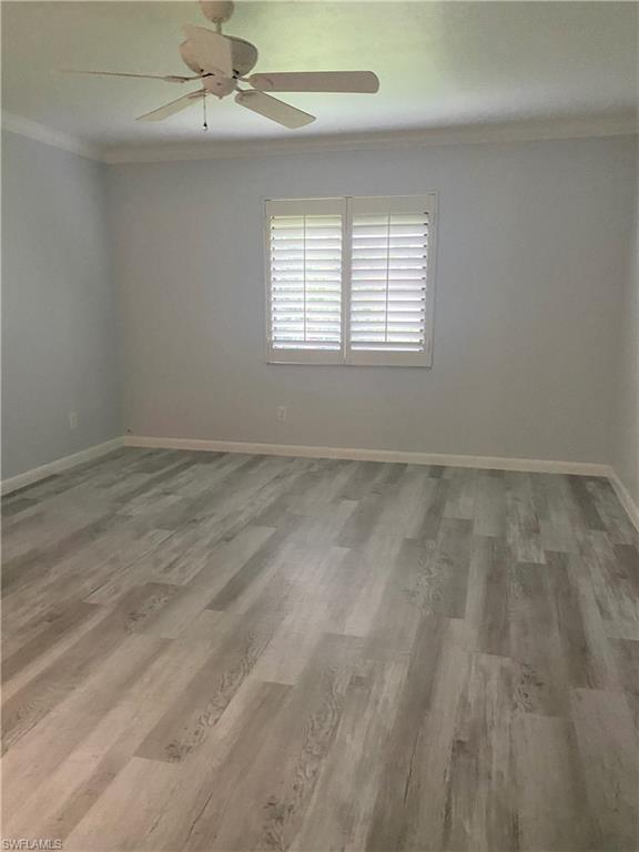 4955 Pepper Circle, Unit B204 Naples, FL 34113 - Photo 10 of 25 an empty room with windows