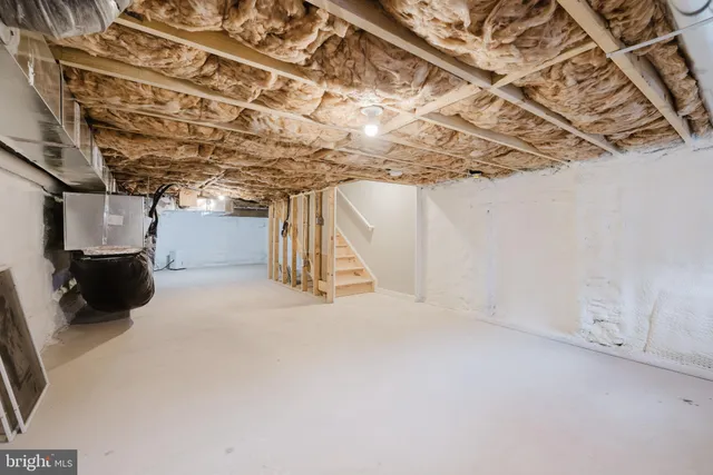 a view of a room with wooden walls