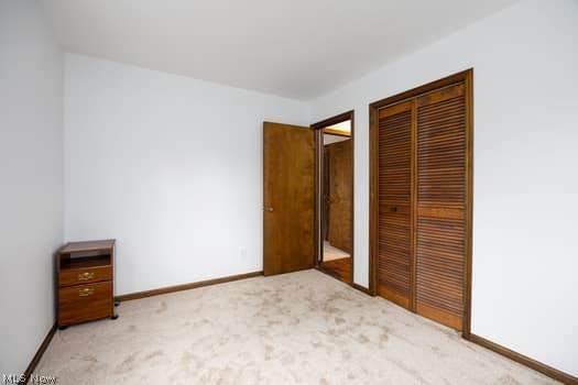 4293 Good Road Seville, OH 44273 - Photo 27 of 35 Unfurnished bedroom featuring light carpet and a closet