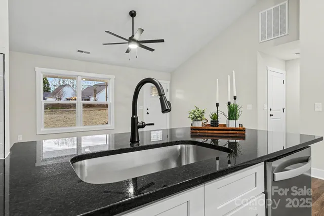 a view of living room with furniture and window