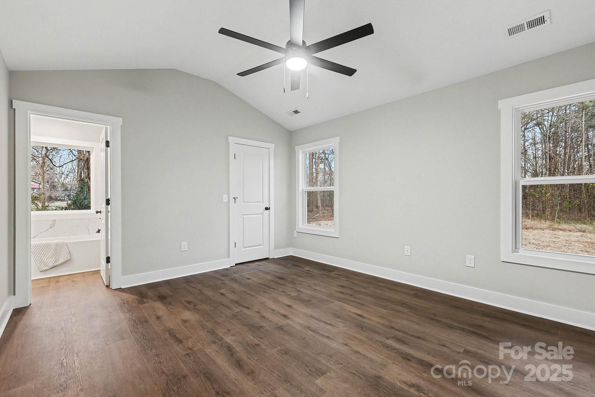 1230 Faith Road Salisbury, NC 28146 - Photo 12 of 26 a view of an empty room with a window and wooden floor