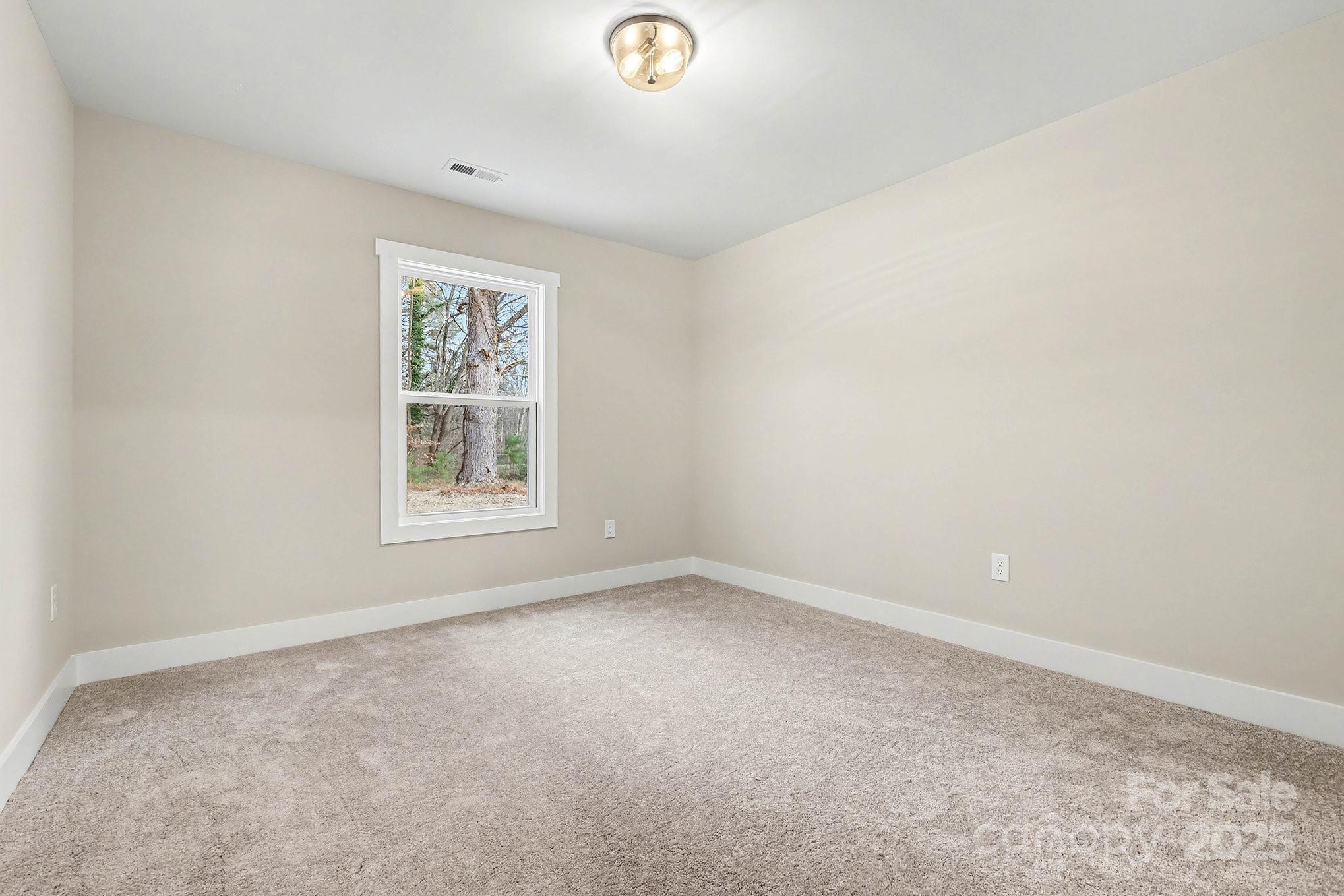 1230 Faith Road Salisbury, NC 28146 - Photo 21 of 26 an empty room with windows
