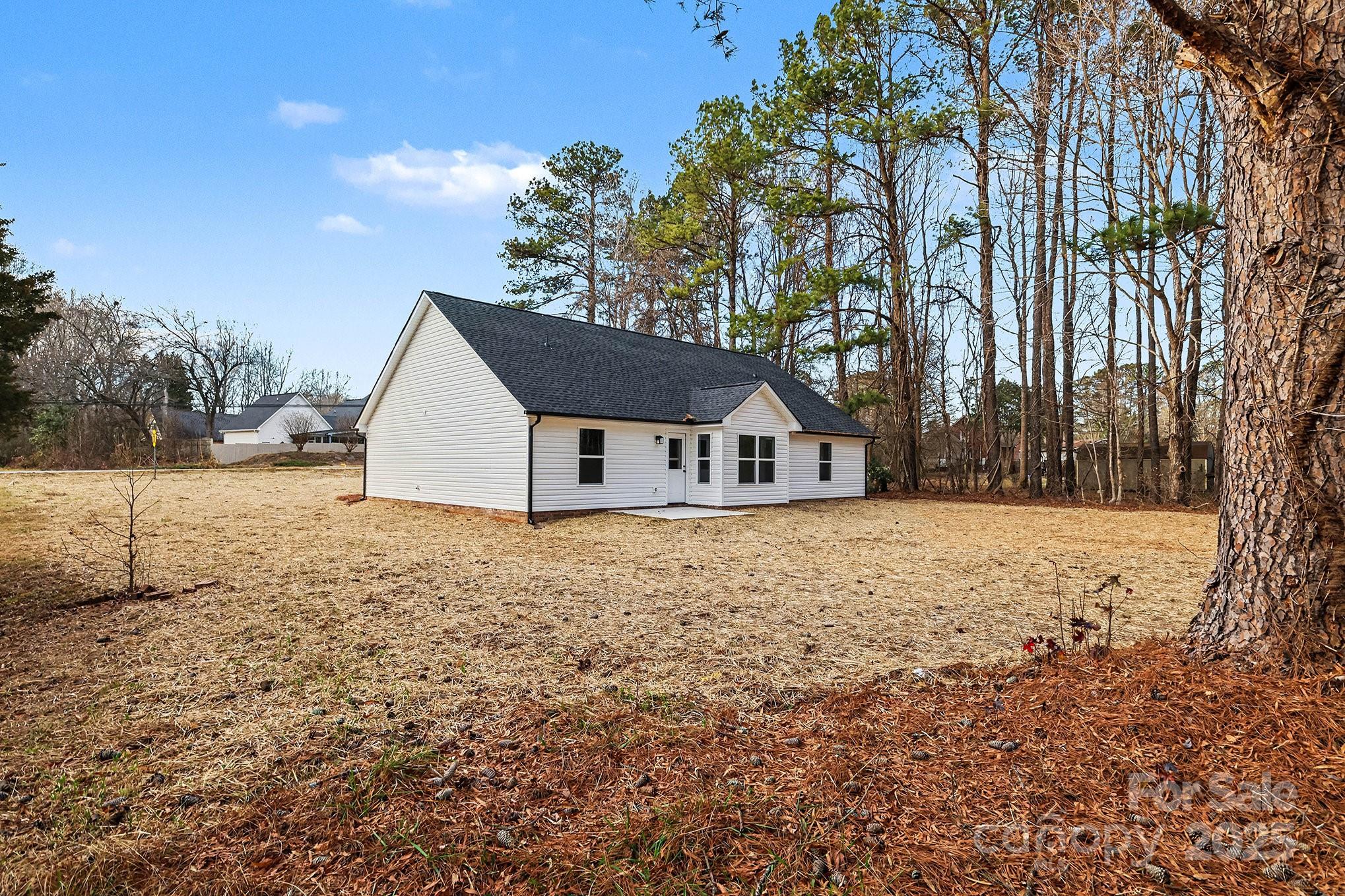 1230 Faith Road Salisbury, NC 28146 - Photo 25 of 26 a house with trees in front of it