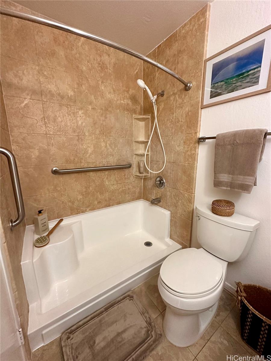 92-993 Makakilo Drive, Unit 45 Kapolei, HI 96707 - Photo 13 of 15 a bathroom with a toilet and a shower