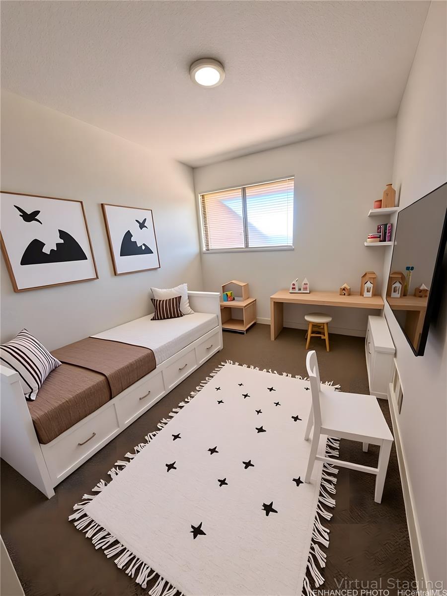 92-993 Makakilo Drive, Unit 45 Kapolei, HI 96707 - Photo 14 of 15 a living room with furniture and a flat screen tv