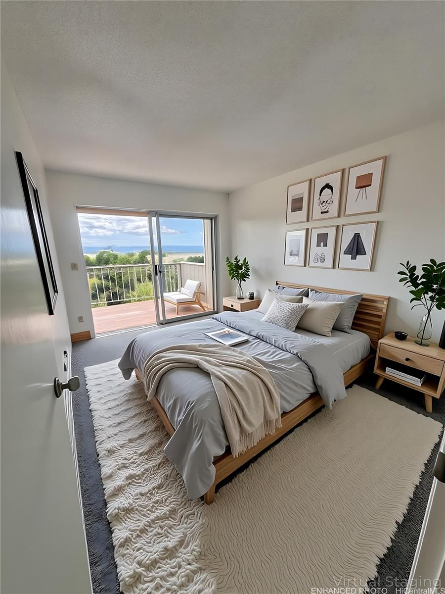 92-993 Makakilo Drive, Unit 45 Kapolei, HI 96707 - Photo 10 of 15 a bedroom with a bed and glass window