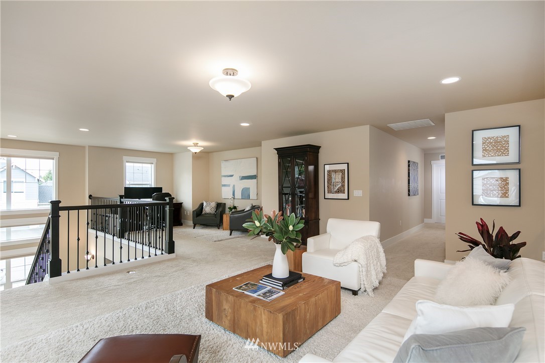 5206 Northeast 2nd Place Renton, WA 98059 - Photo 14 of 30 a living room with furniture potted plant and a table
