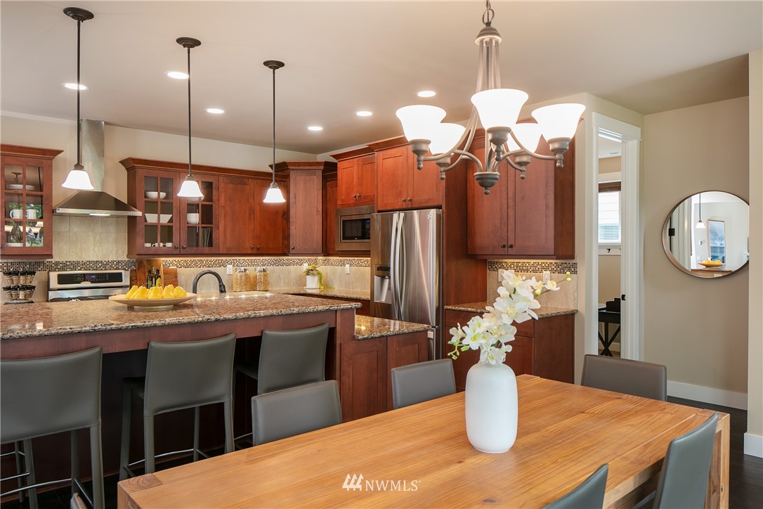 5206 Northeast 2nd Place Renton, WA 98059 - Photo 8 of 30 a kitchen with a table and chairs