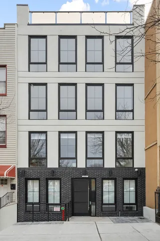 a view of a patio with table and chairs and potted plants
